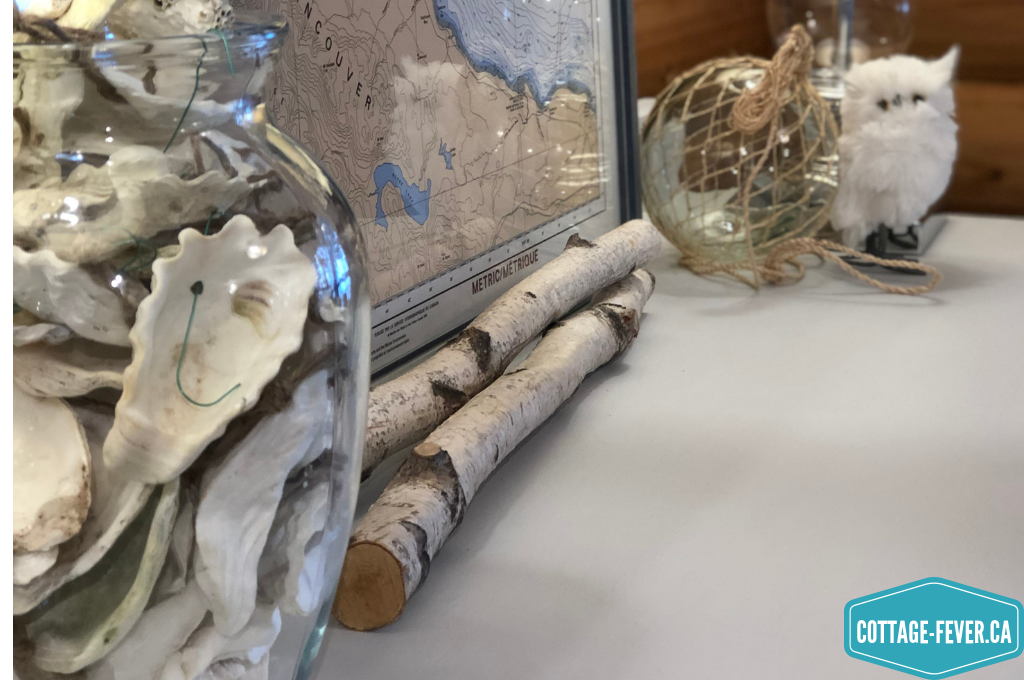 nautical map, birch branches, glass fishing float, white owl, vase, oyster shells