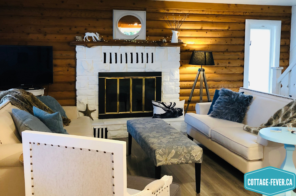 Log home, living room, white painted fireplace, mantel decorations, winter decor, white decor