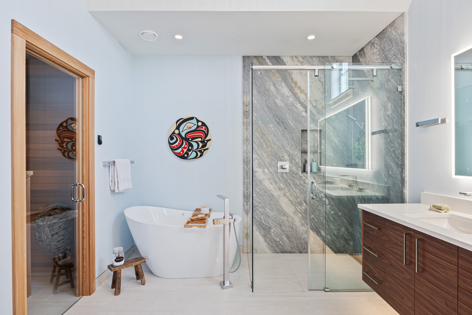 Marble, quarried on Vancouver Island, lines the shower walls